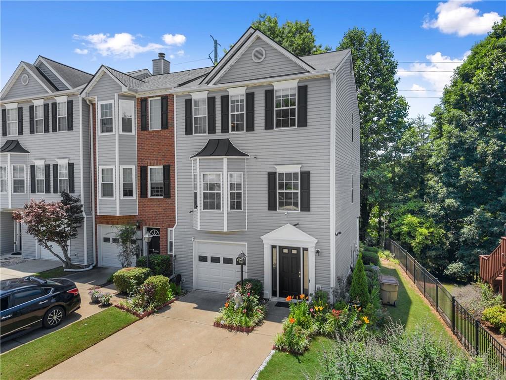 1628 Indian Way Cumming, GA 30040 - Photo 2 of 39 a front view of a house with a yard