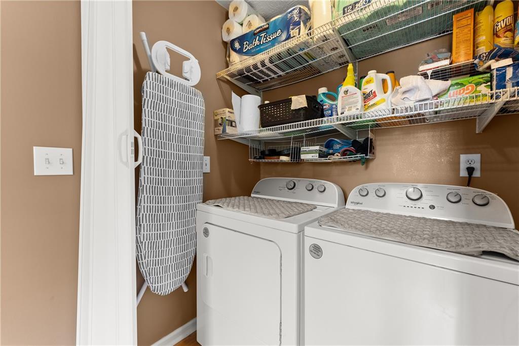 1628 Indian Way Cumming, GA 30040 - Photo 24 of 39 a utility room with dryer and washer