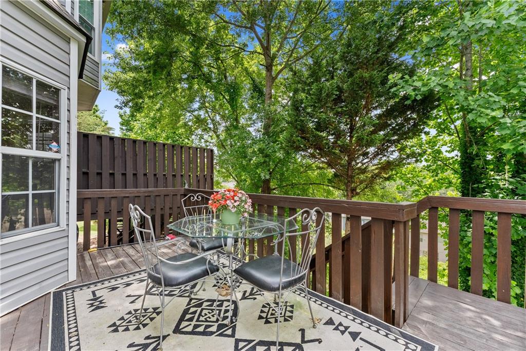 1628 Indian Way Cumming, GA 30040 - Photo 29 of 39 a view of balcony with wooden floor and outdoor seating