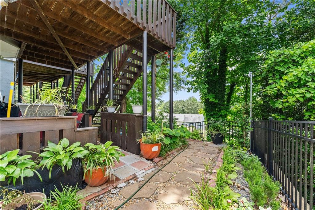 1628 Indian Way Cumming, GA 30040 - Photo 30 of 39 a garden view with a seating space