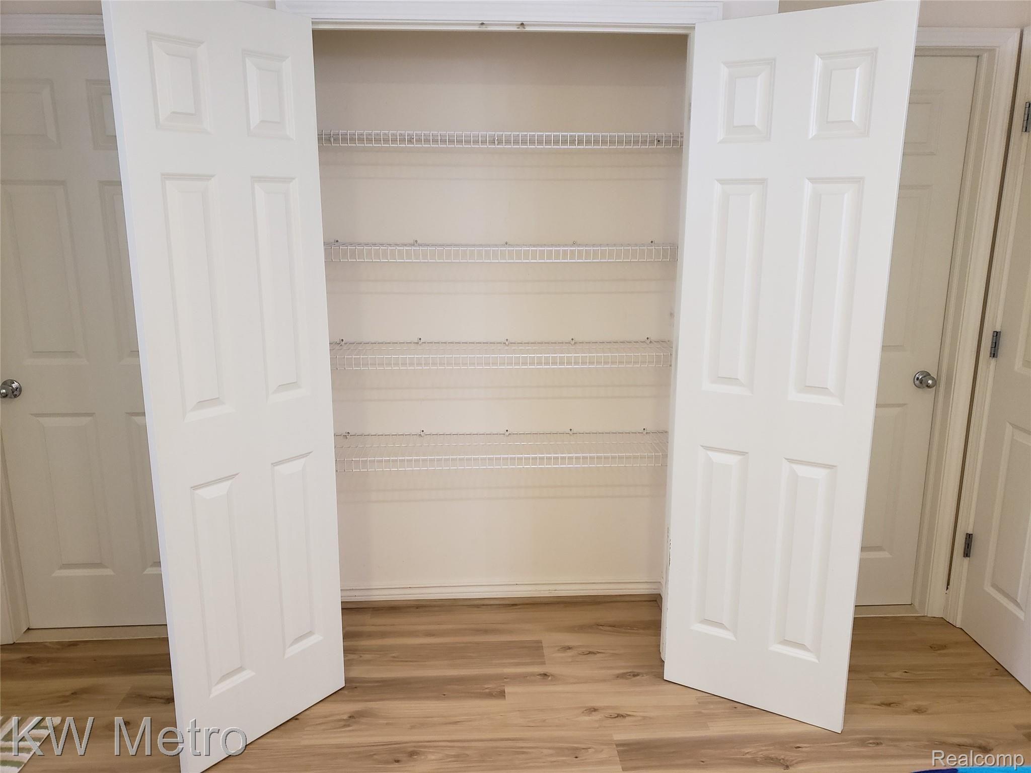 1227 Letica Drive Rochester, MI 48307 - Photo 54 of 58 Primary Bathroom Linen Closet