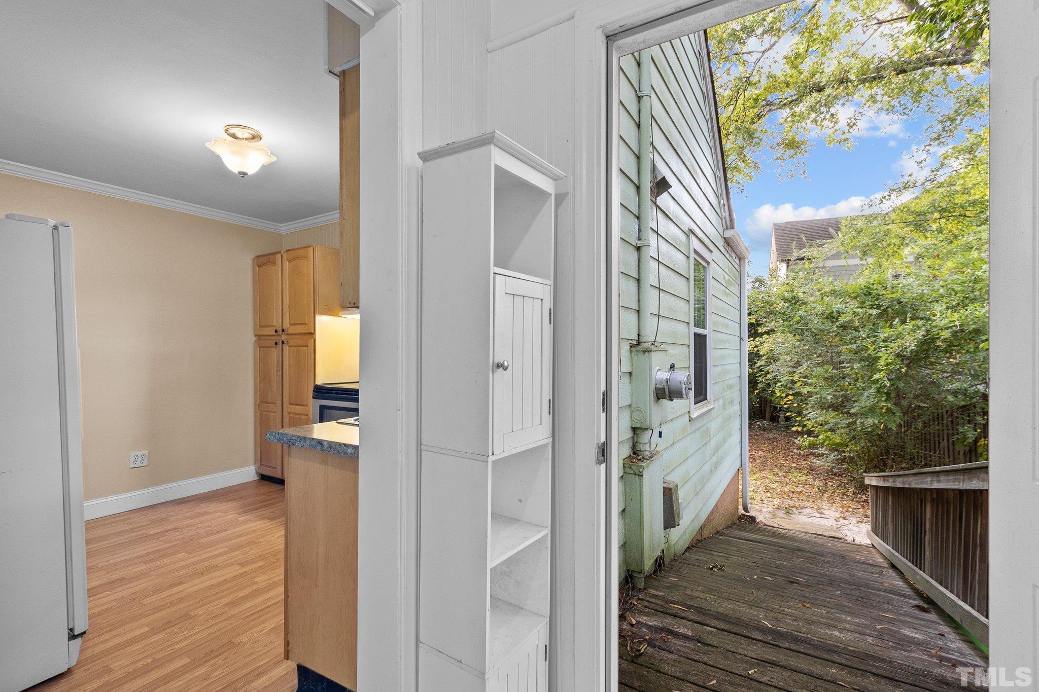 1713 Oberlin Road Raleigh, NC 27608 - Photo 13 of 34 a view of a hallway with wooden floor and entryway