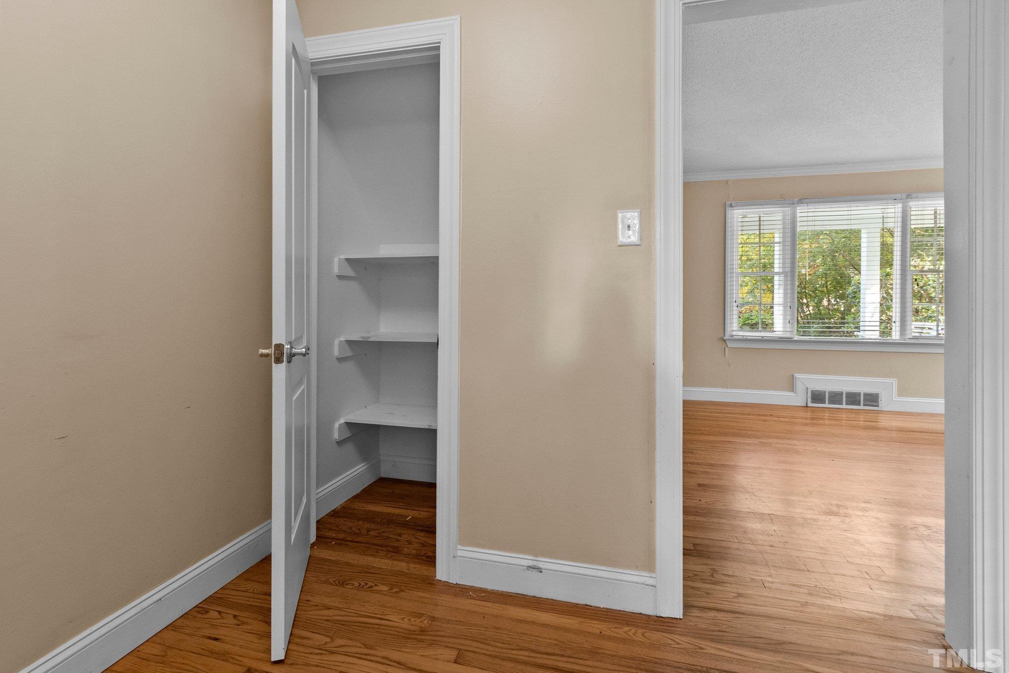 1713 Oberlin Road Raleigh, NC 27608 - Photo 16 of 34 a view of hallway with wooden floor