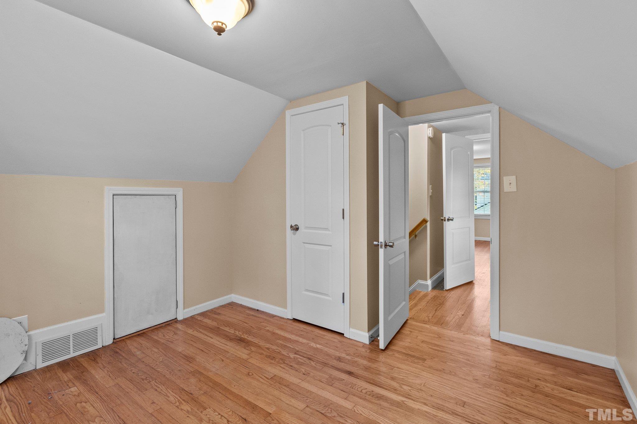 1713 Oberlin Road Raleigh, NC 27608 - Photo 23 of 34 a view of a hallway with wooden floor