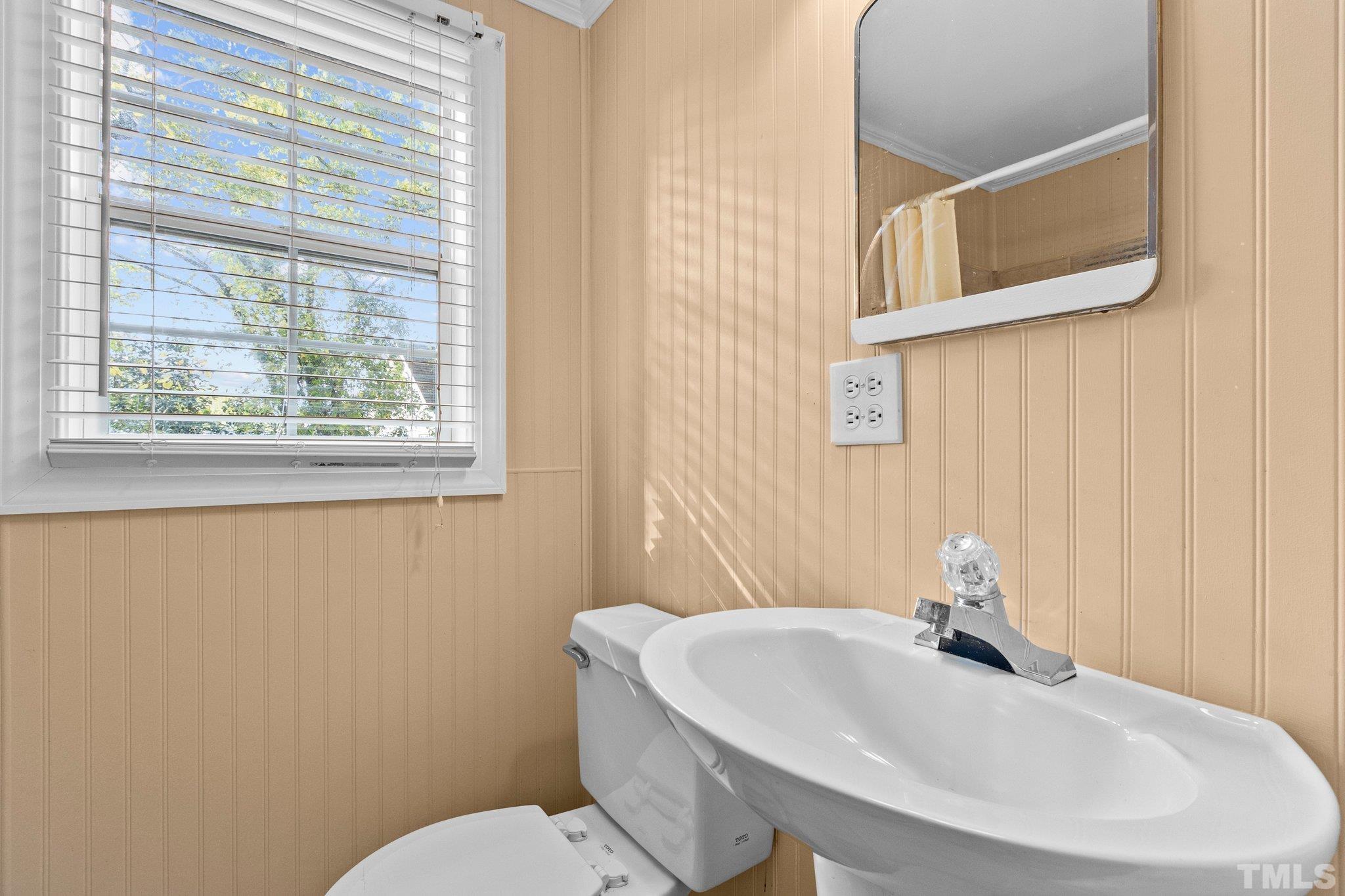 1713 Oberlin Road Raleigh, NC 27608 - Photo 24 of 34 a bathroom with a sink and a toilet
