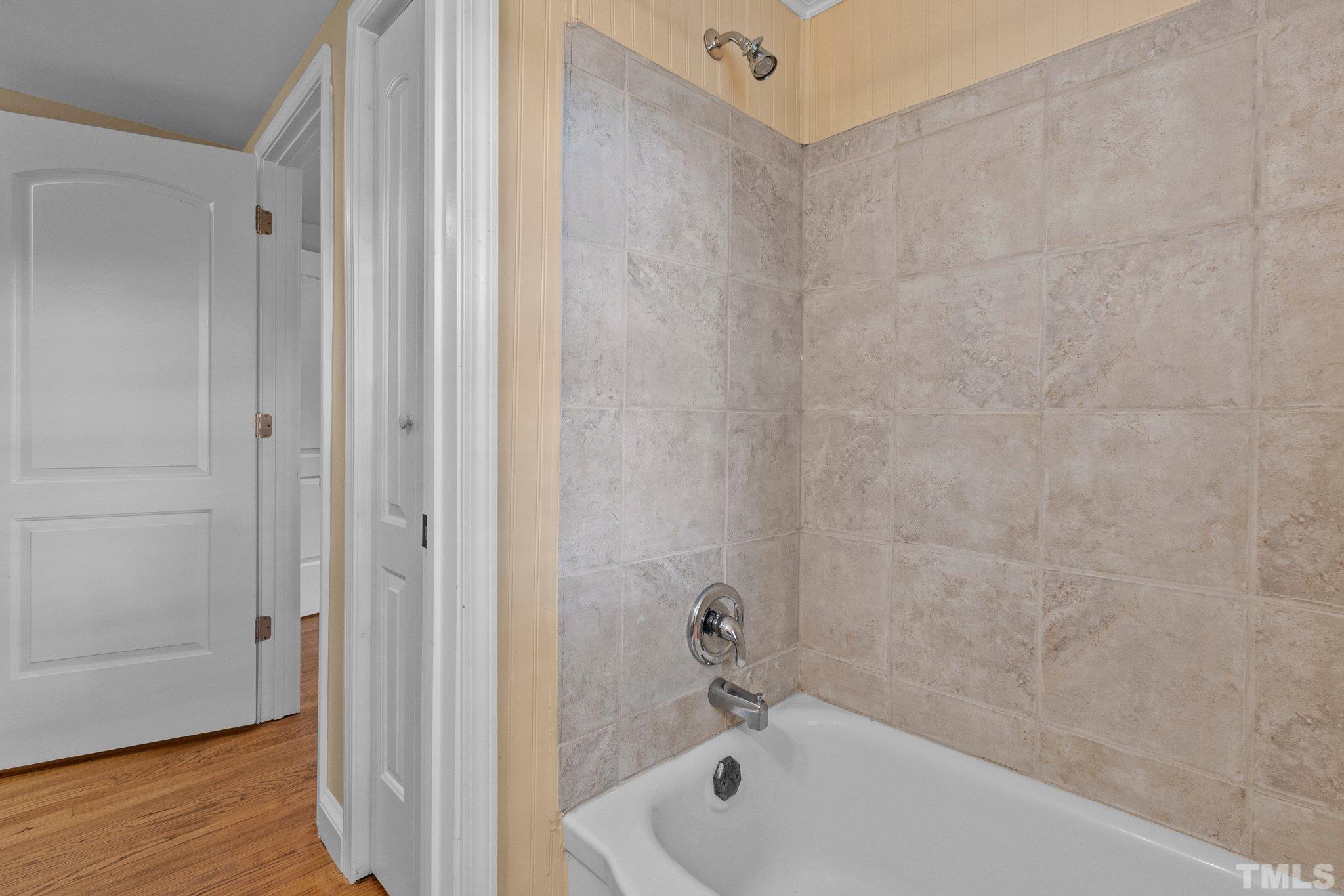 1713 Oberlin Road Raleigh, NC 27608 - Photo 25 of 34 a bathroom with a tub and shower