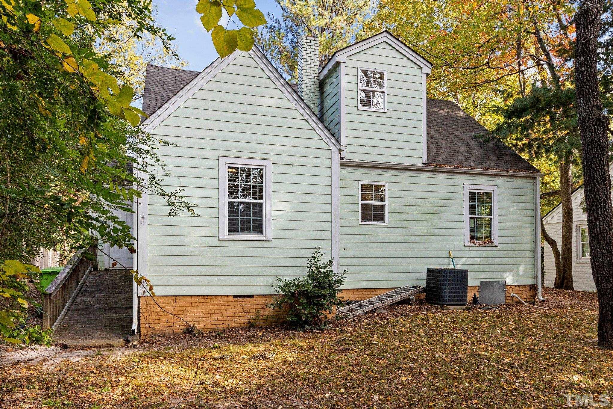 1713 Oberlin Road Raleigh, NC 27608 - Photo 26 of 34 a front view of a house with a yard