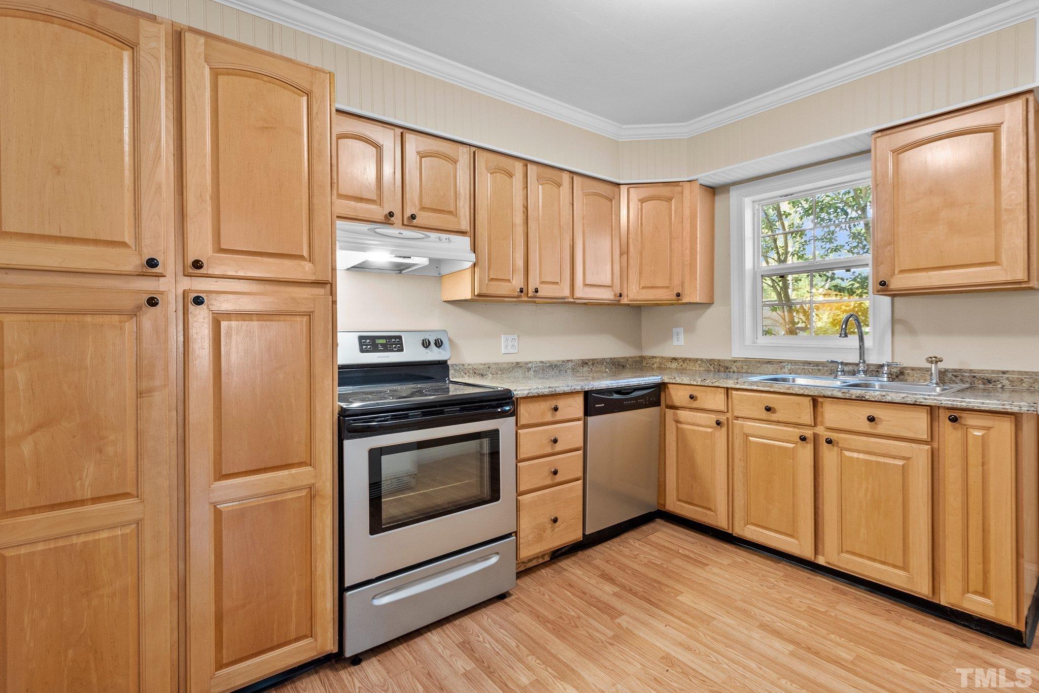 1713 Oberlin Road Raleigh, NC 27608 - Photo 9 of 34 a kitchen with granite countertop stainless steel appliances a stove sink and cabinets