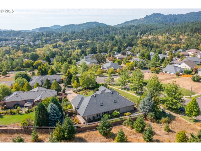 an aerial view of residential house with an outdoor space