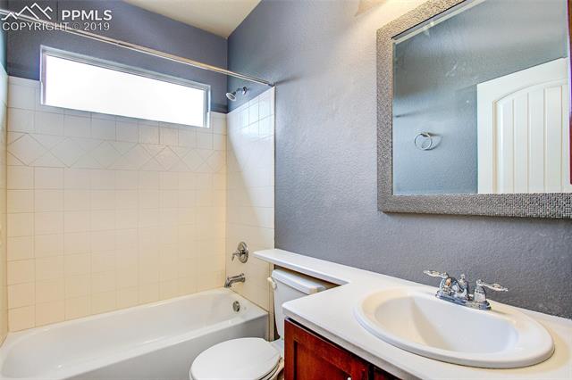 2384 Cinnabar Road Colorado Springs, CO 80921 - Photo 16 of 28 Main level full bathroom.