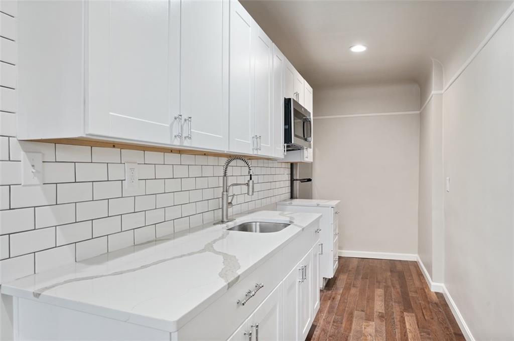 4827 Sciota Street Pittsburgh, PA 15224 - Photo 16 of 19 a bathroom with a sink a toilet and shower