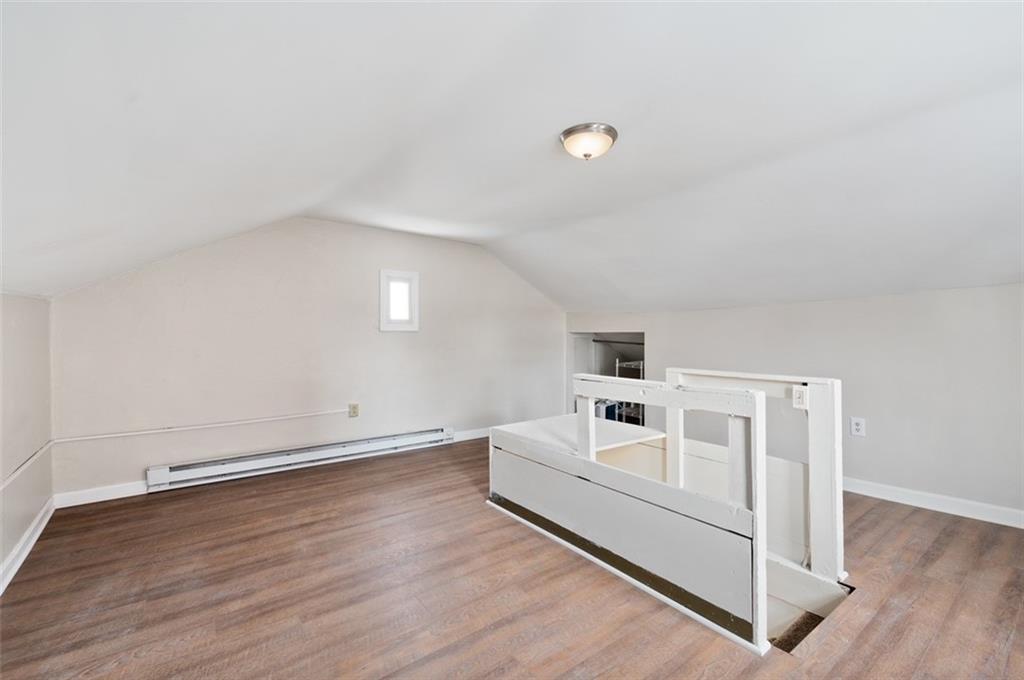 4827 Sciota Street Pittsburgh, PA 15224 - Photo 3 of 19 a white room with wooden floor and white walls