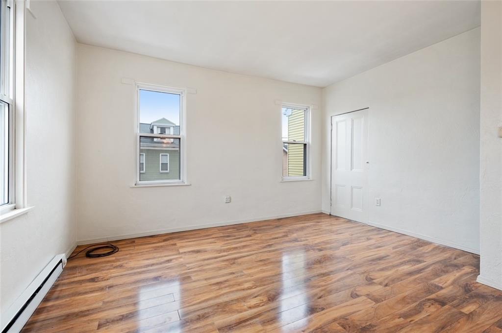 4827 Sciota Street Pittsburgh, PA 15224 - Photo 7 of 19 a view of empty room with wooden floor and fan