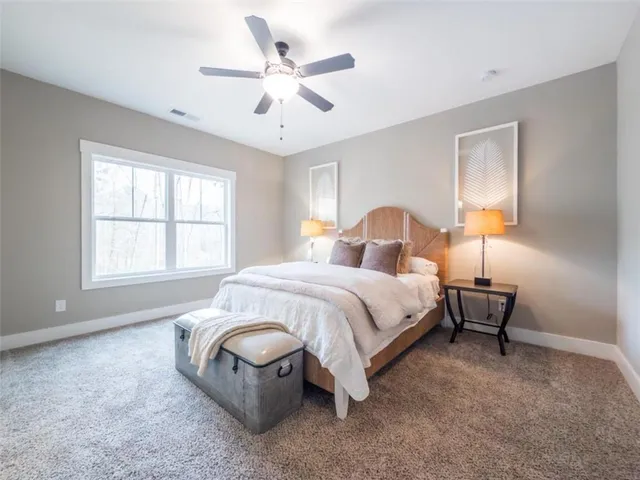 a bathroom with double vanity sinks and a mirror