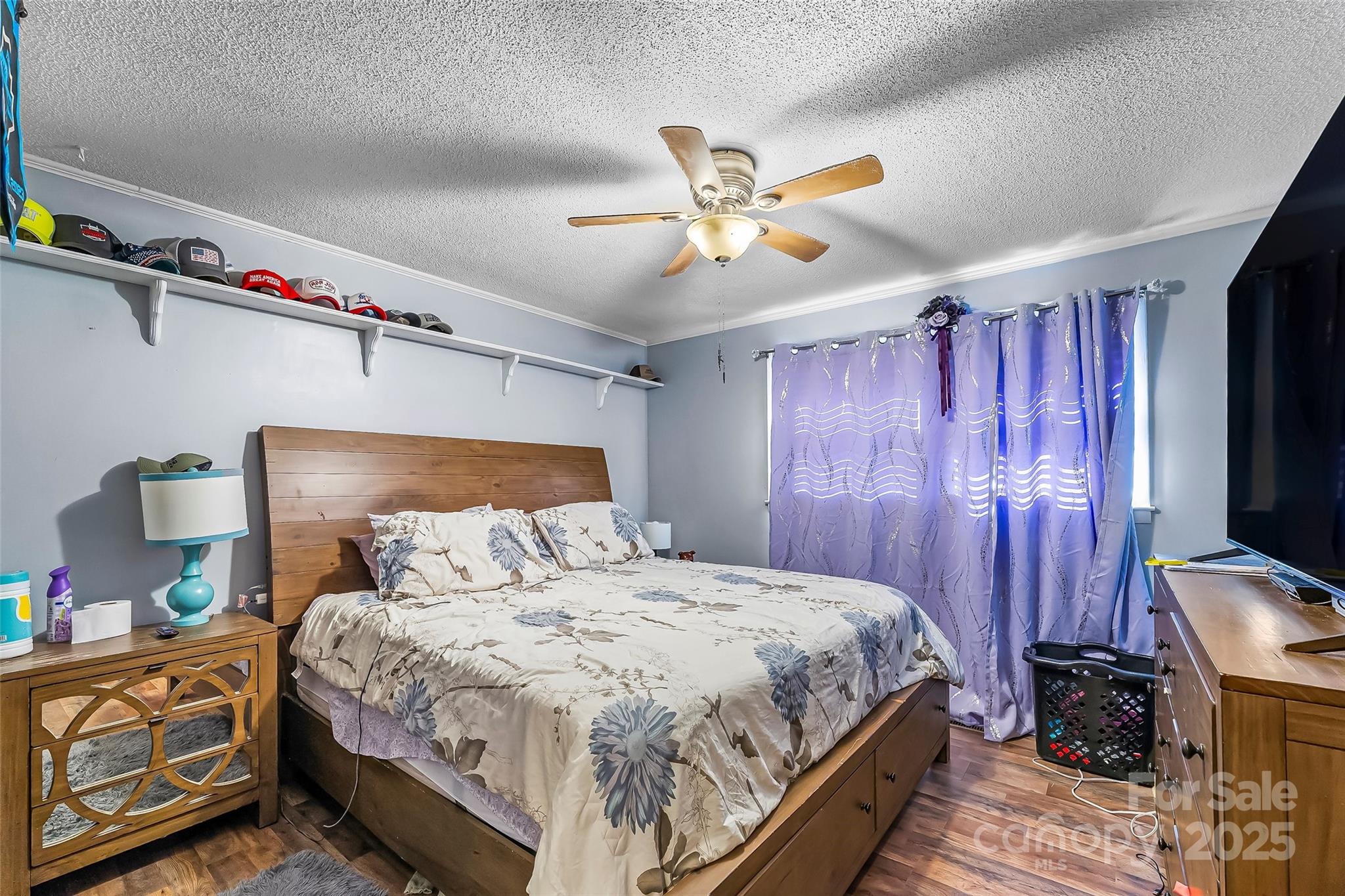 304 Parlier Avenue Conover, NC 28613 - Photo 14 of 37 a bedroom with a bed and a chandelier