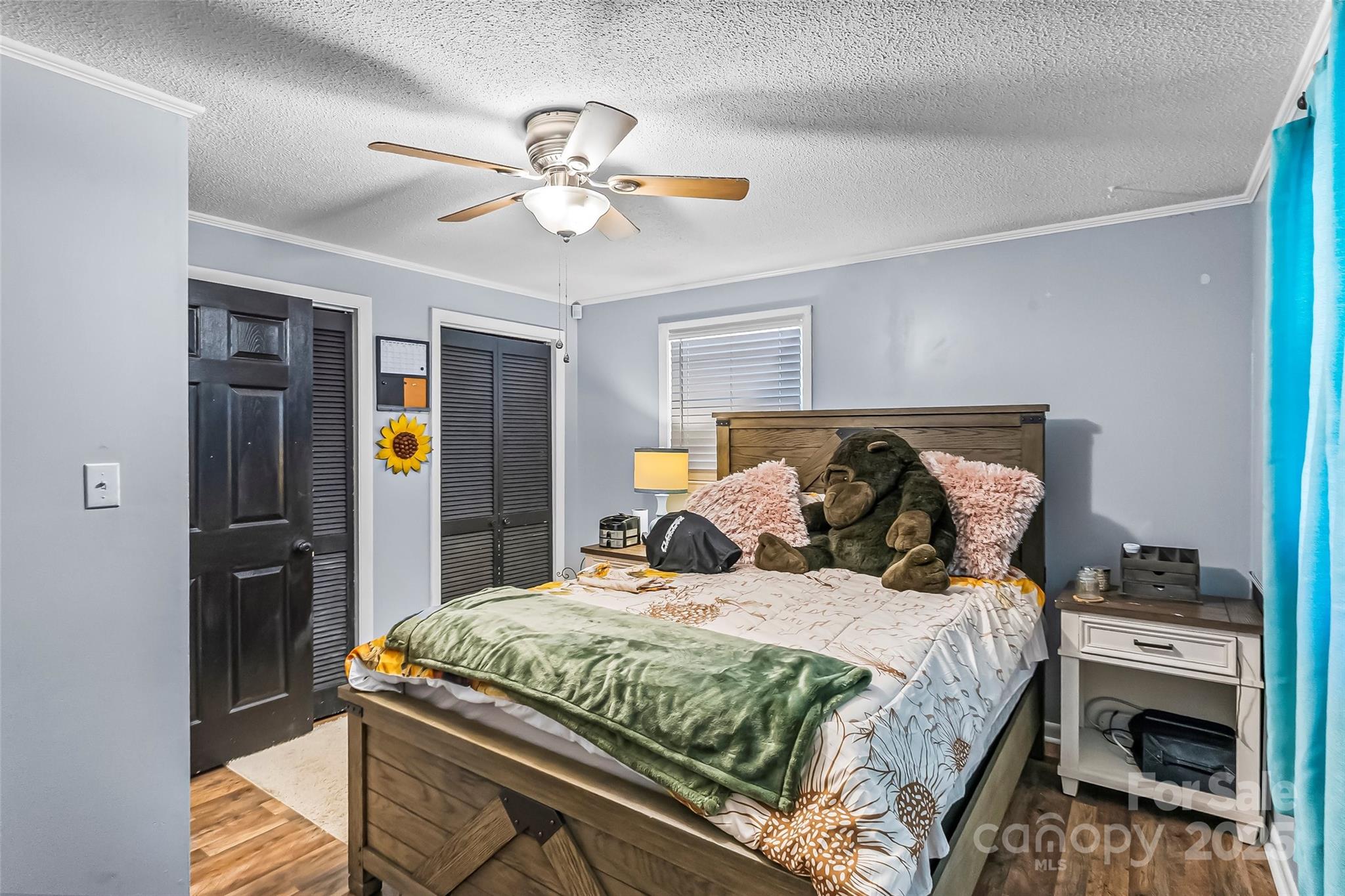 304 Parlier Avenue Conover, NC 28613 - Photo 15 of 37 a bedroom with a bed and a chandelier