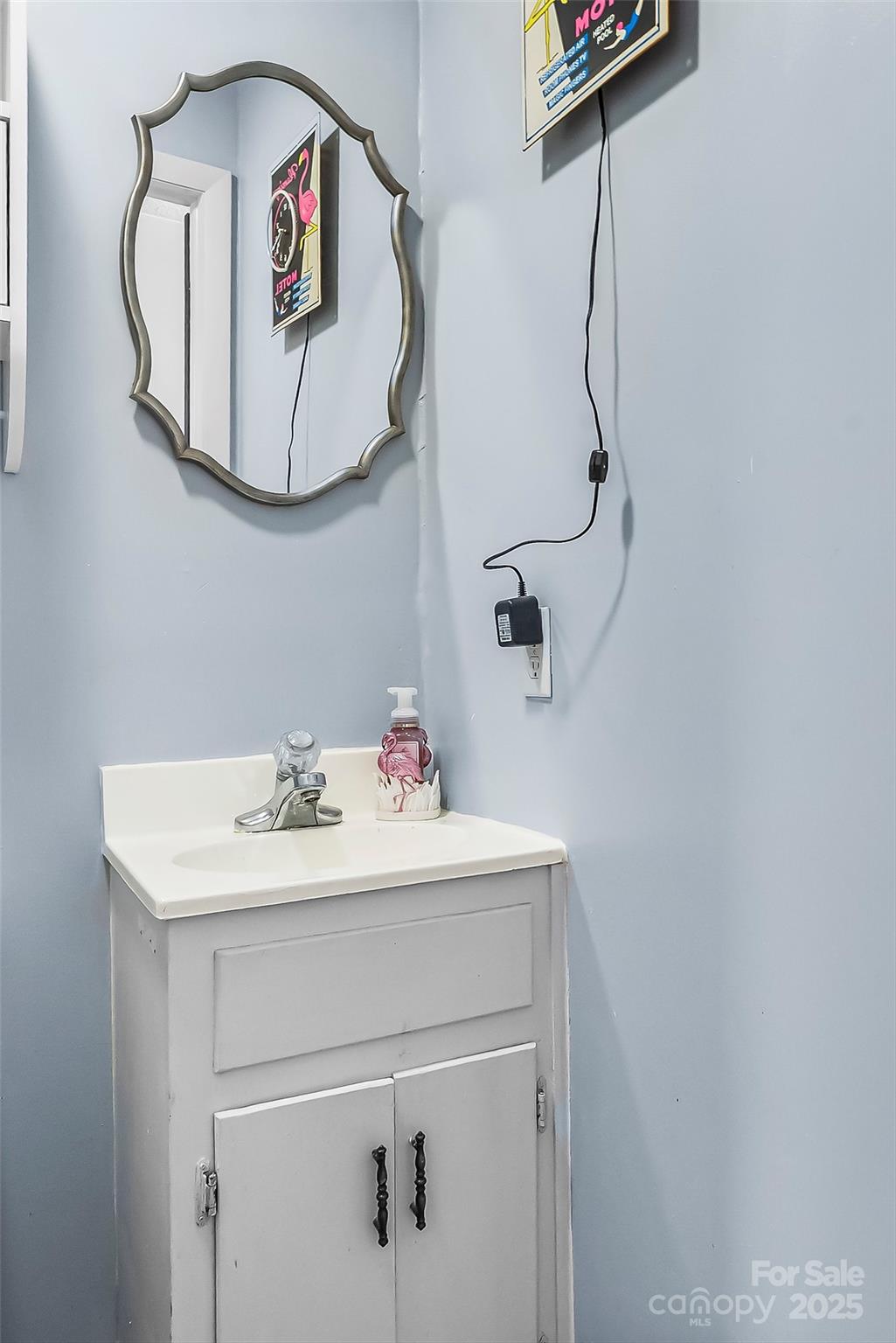 304 Parlier Avenue Conover, NC 28613 - Photo 20 of 37 a bathroom with a sink and a mirror