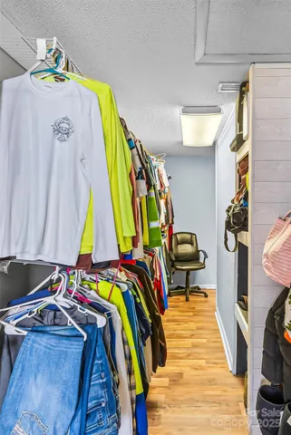 a view of living room kitchen with furniture and outdoor shower