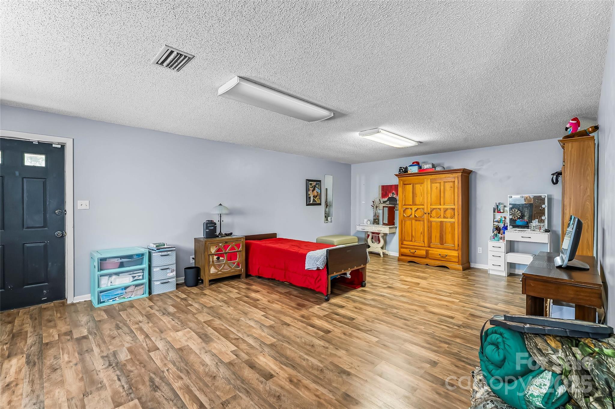 304 Parlier Avenue Conover, NC 28613 - Photo 22 of 37 a bedroom with a bed and wooden floor