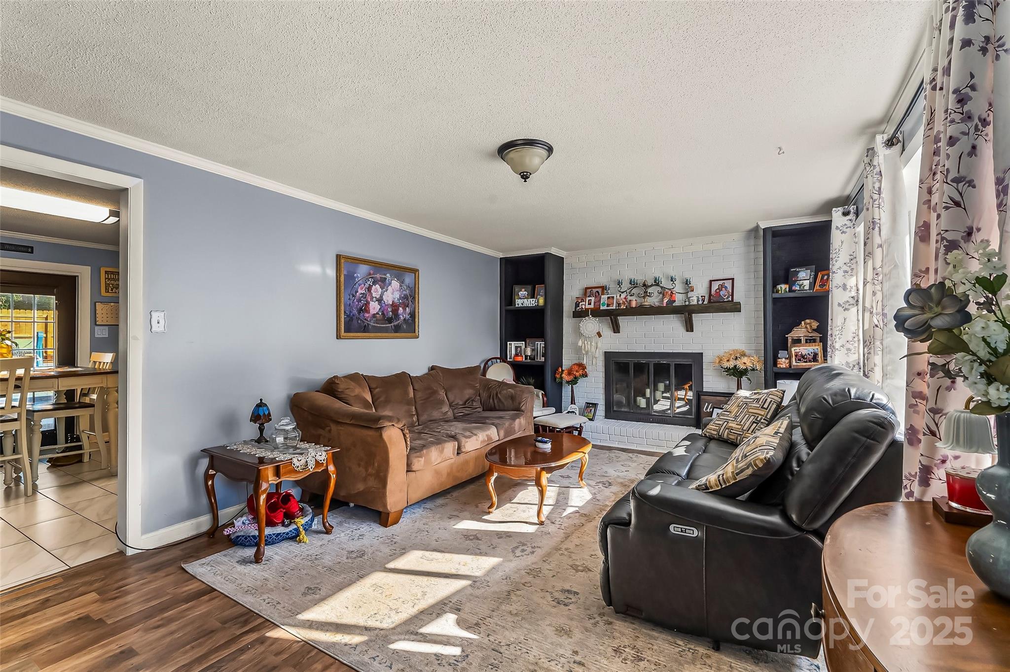 304 Parlier Avenue Conover, NC 28613 - Photo 5 of 37 a living room with furniture and a fireplace