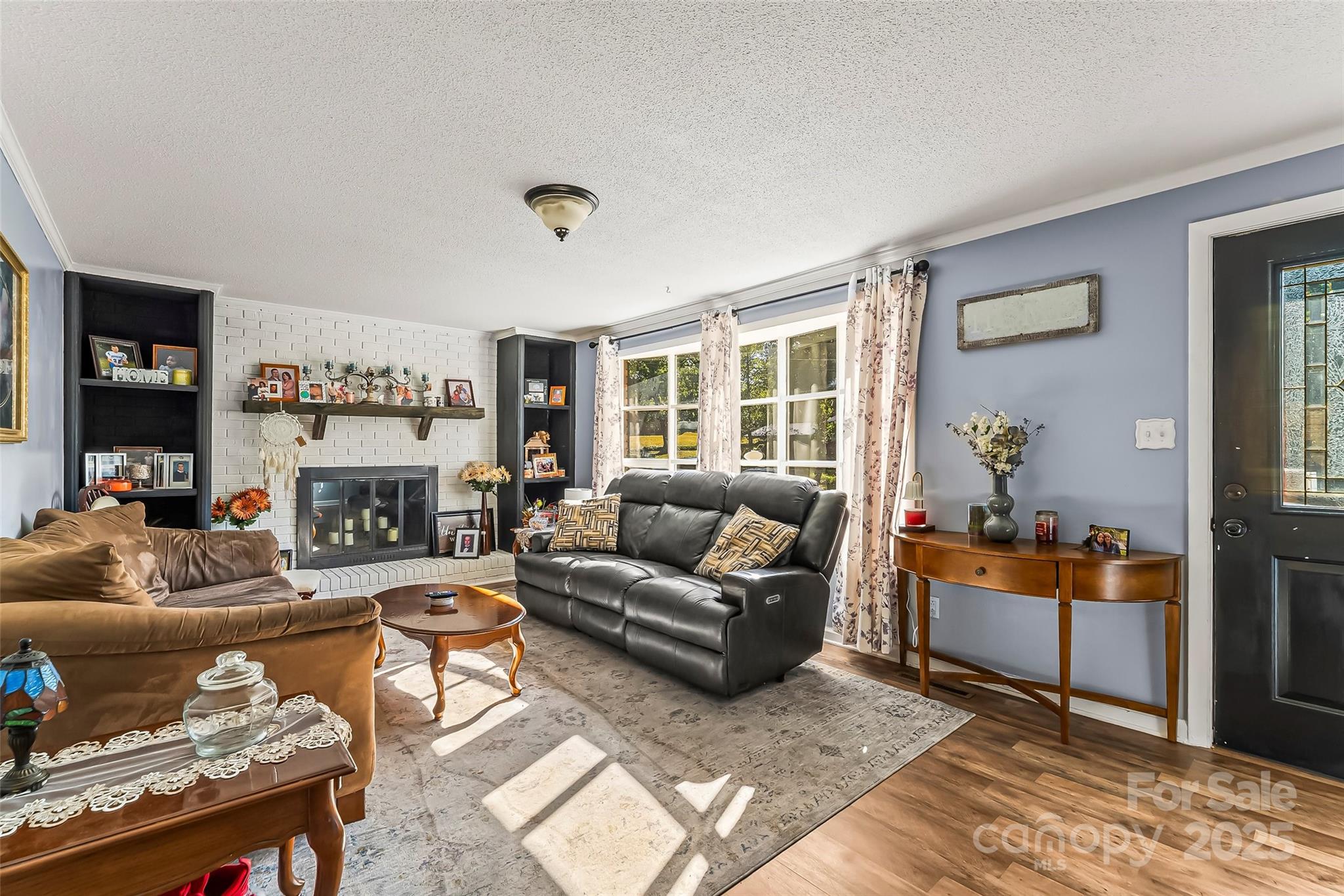 304 Parlier Avenue Conover, NC 28613 - Photo 6 of 37 a living room with furniture and a fireplace