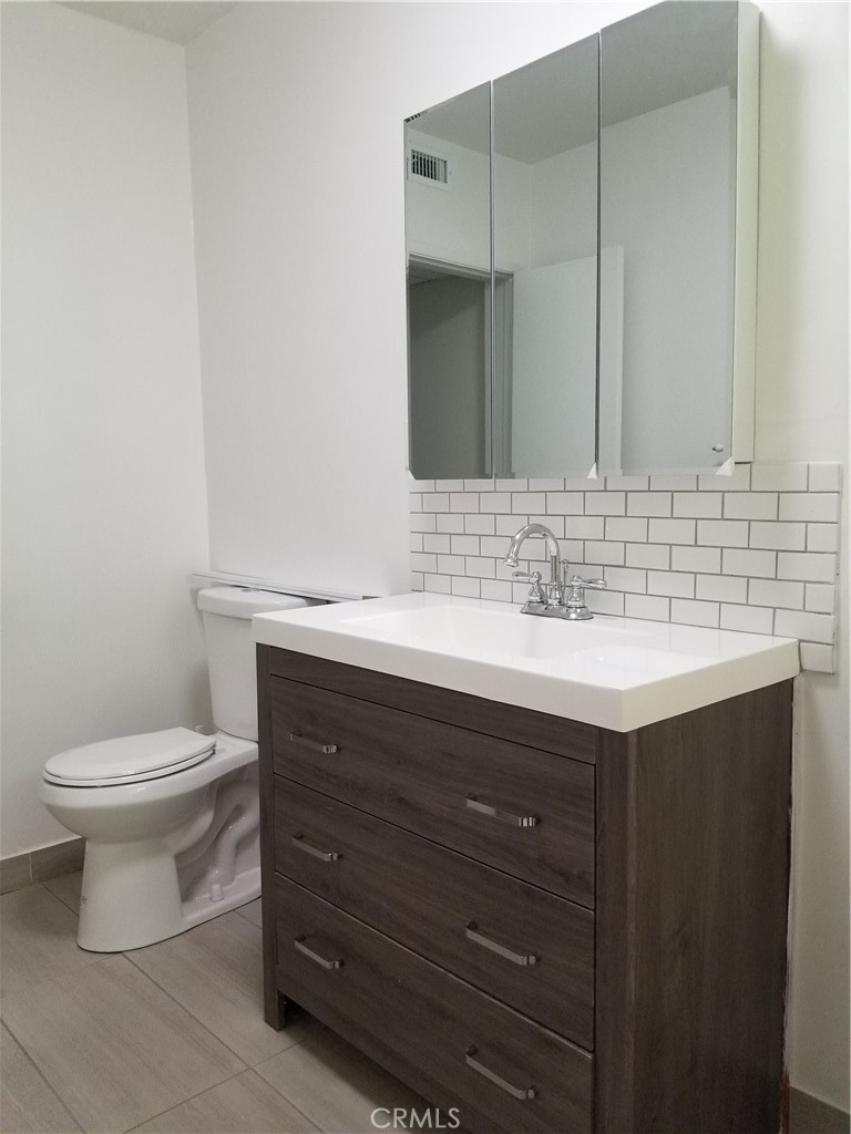 312 East Dryden Street, Unit 3 Glendale, CA 91207 - Photo 12 of 13 a bathroom with a sink vanity and a toilet