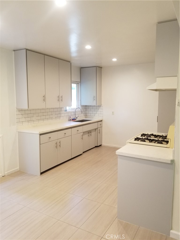 312 East Dryden Street, Unit 3 Glendale, CA 91207 - Photo 4 of 13 a kitchen with stainless steel appliances granite countertop a stove a sink and a refrigerator