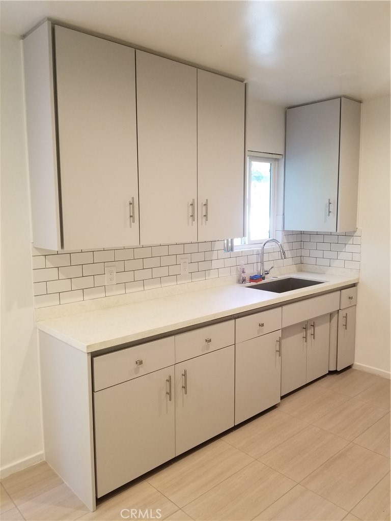 312 East Dryden Street, Unit 3 Glendale, CA 91207 - Photo 6 of 13 a bathroom with a sink and cabinets