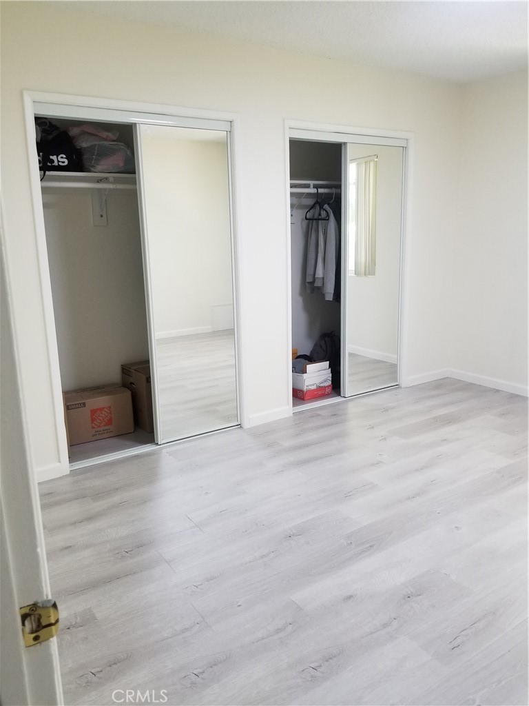 312 East Dryden Street, Unit 3 Glendale, CA 91207 - Photo 7 of 13 an empty room with wooden floor and closet