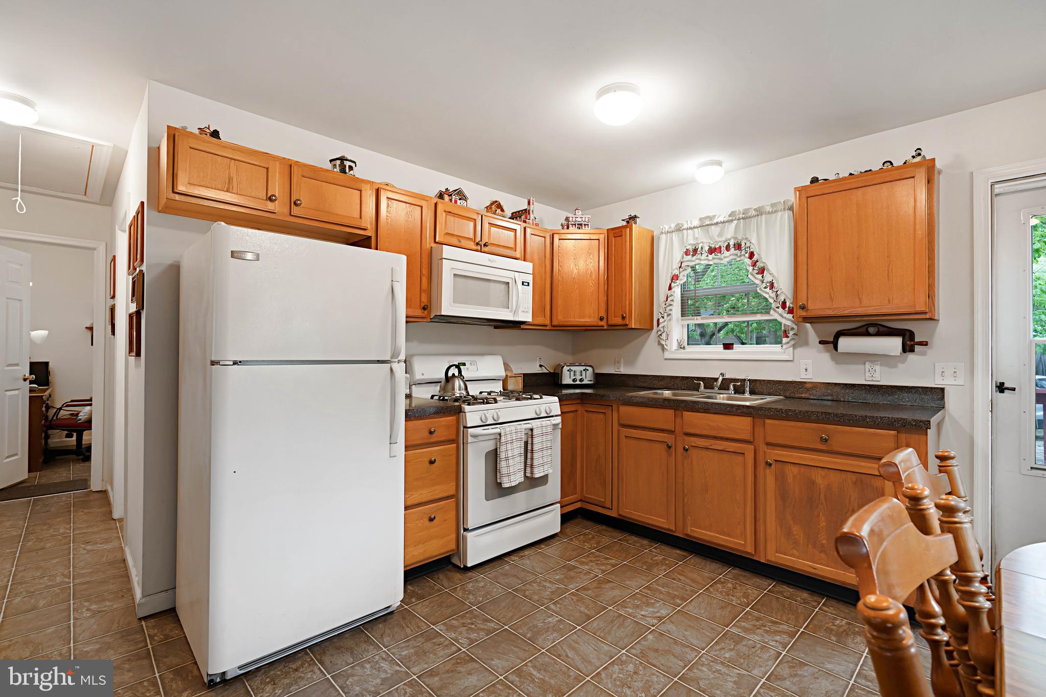 315 Beech Road Millville, NJ 08332 - Photo 6 of 21 a kitchen with stainless steel appliances granite countertop a refrigerator a stove a sink and a microwave