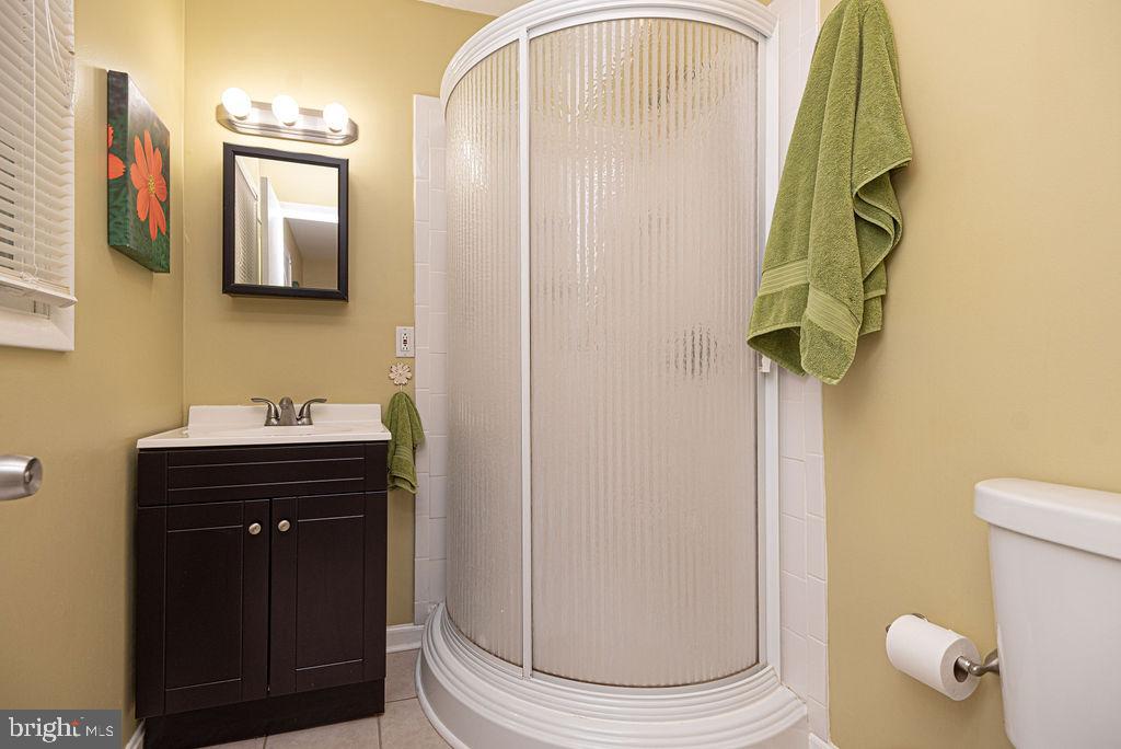 33 Falcon Bridge Road Ocean Pines, MD 21811 - Photo 48 of 71 a bathroom with a sink a toilet and mirror