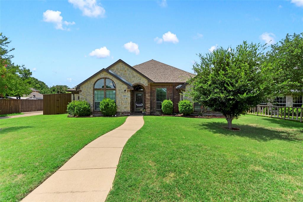 8014 Garner Road Rowlett, TX 75088 - Photo 2 of 39 a front view of a house with a yard