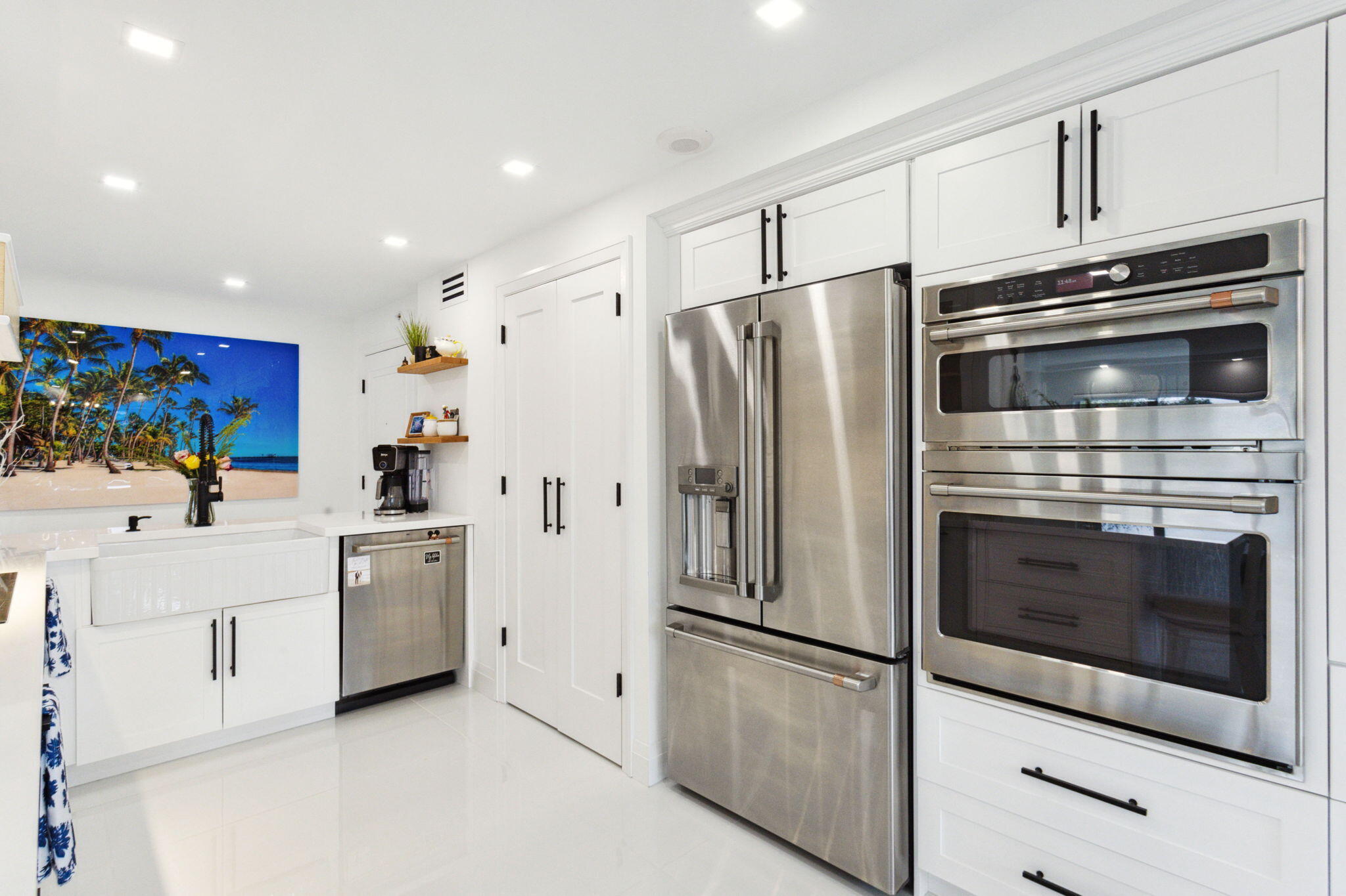 a kitchen with stainless steel appliances cabinets and a counter top space