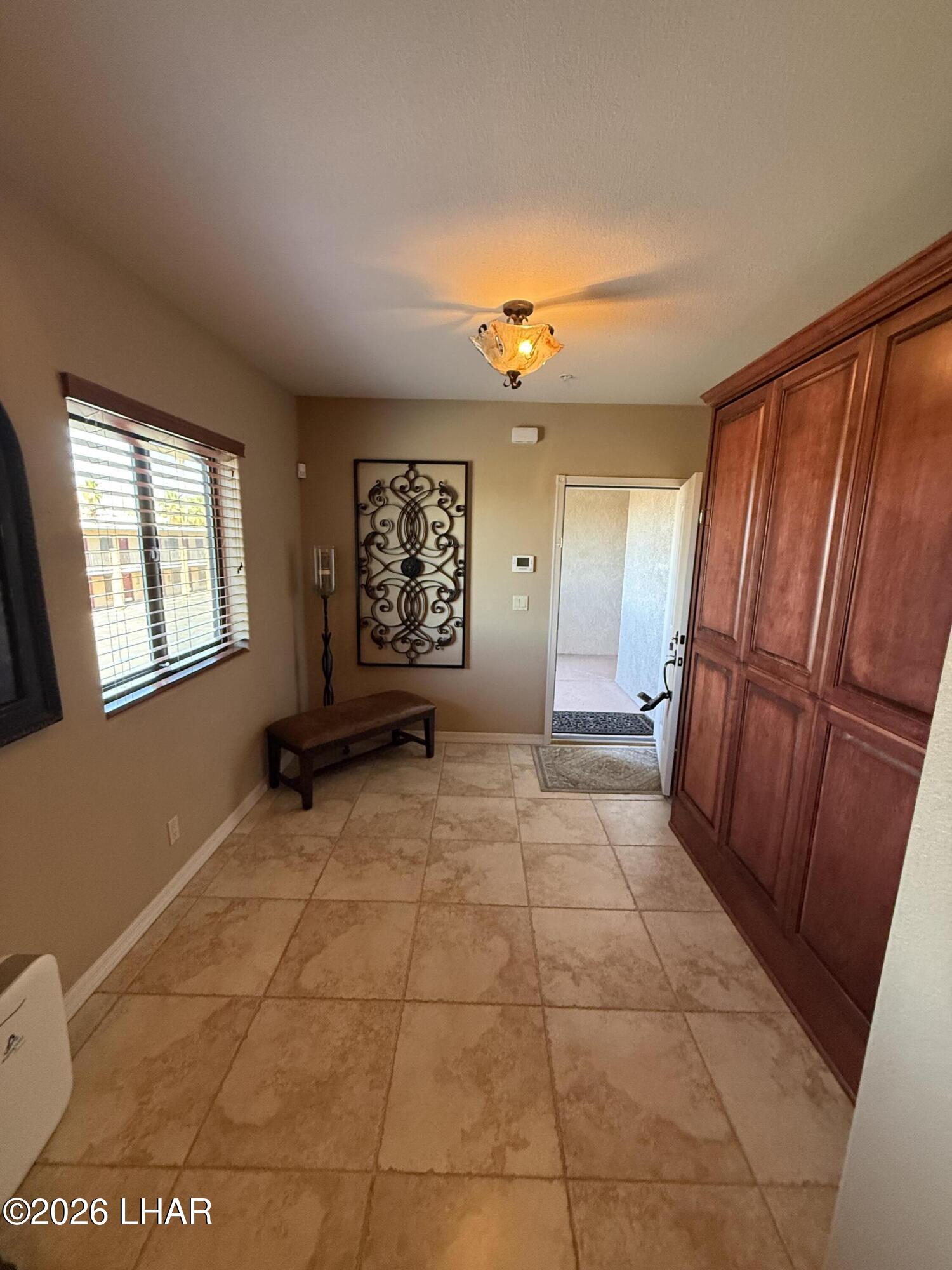 433 London Bridge Road, Unit B101 Lake Havasu City, AZ 86403 - Photo 13 of 35 a view of an empty room with a window