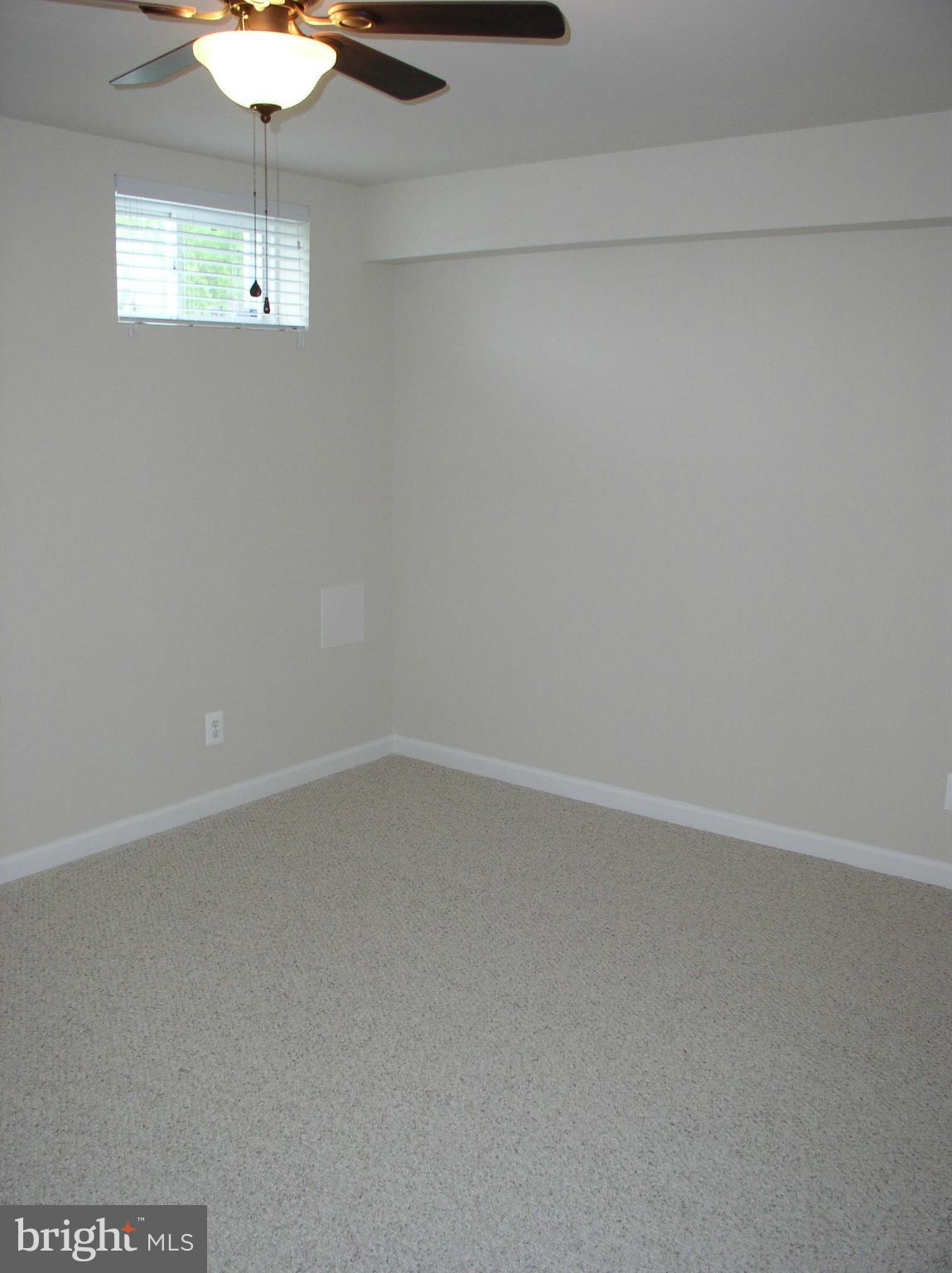 5910 A Sunlight Mountain Road, Unit A Spotsylvania, VA 22553 - Photo 12 of 24 a view of an empty room with a window