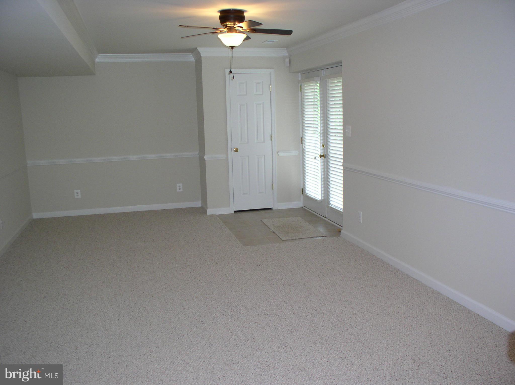 5910 A Sunlight Mountain Road, Unit A Spotsylvania, VA 22553 - Photo 6 of 24 an empty room with chandelier fan