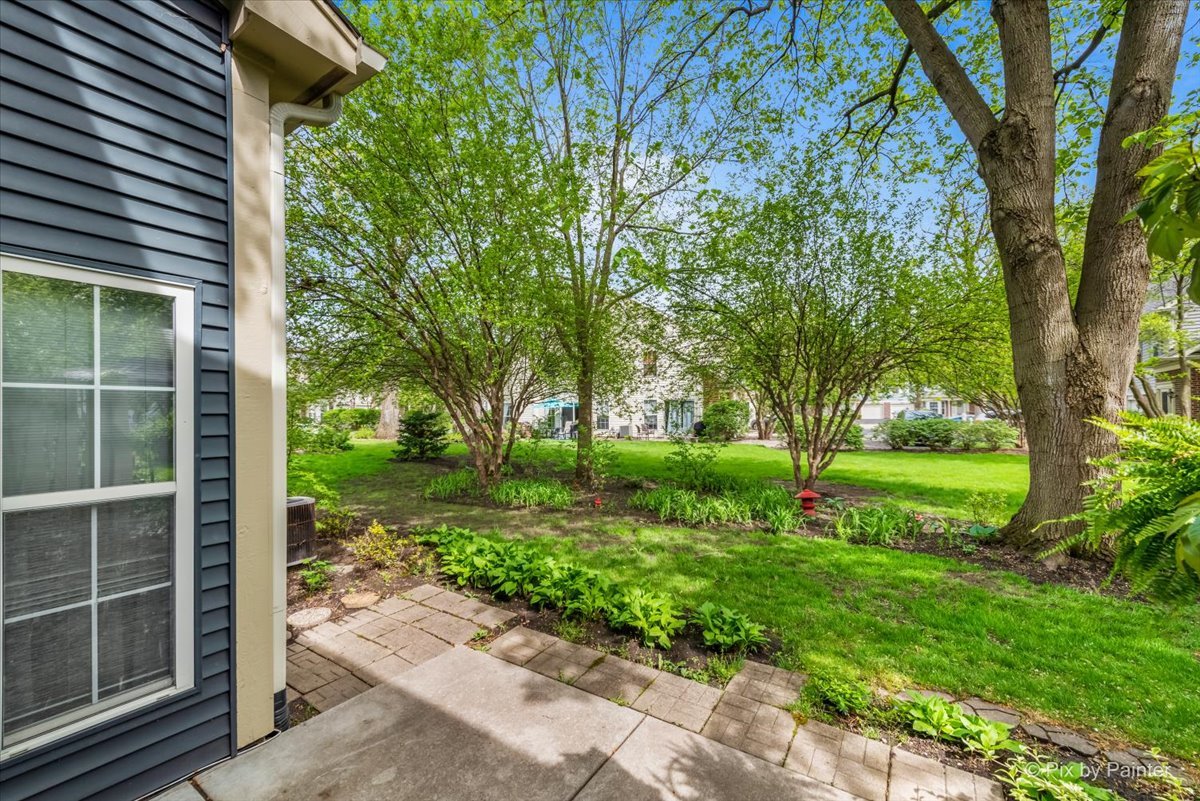 687 Bent Ridge Lane Elgin, IL 60120 - Photo 25 of 28 a view of a house with a yard