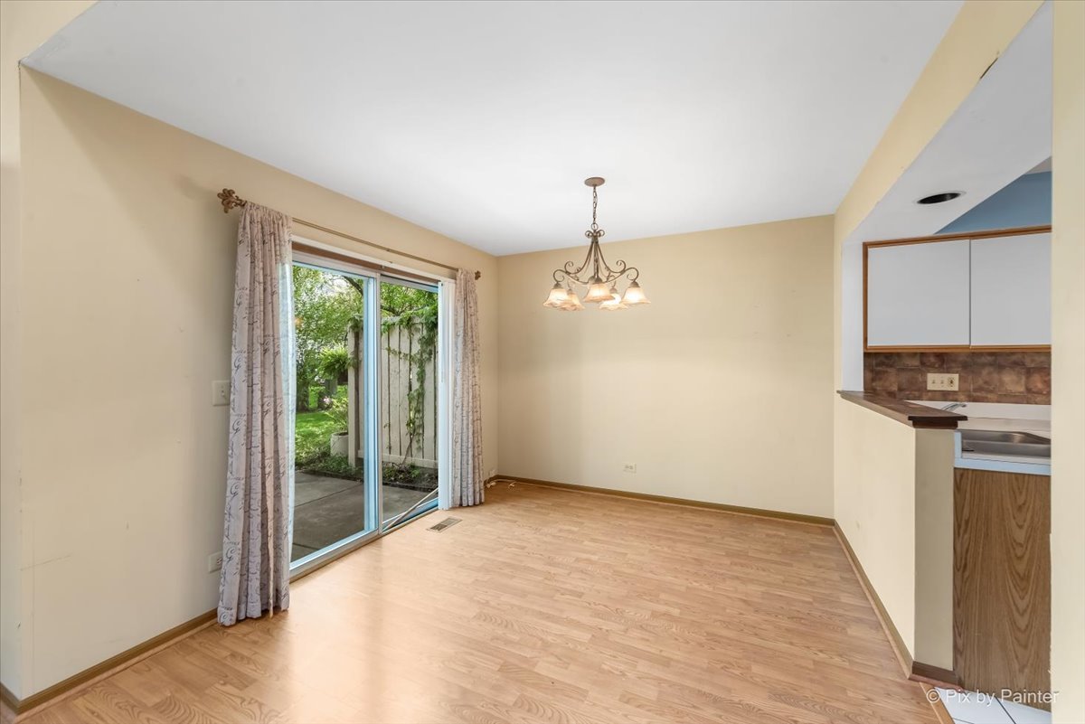 687 Bent Ridge Lane Elgin, IL 60120 - Photo 4 of 28 a view of empty room with wooden floor and fan