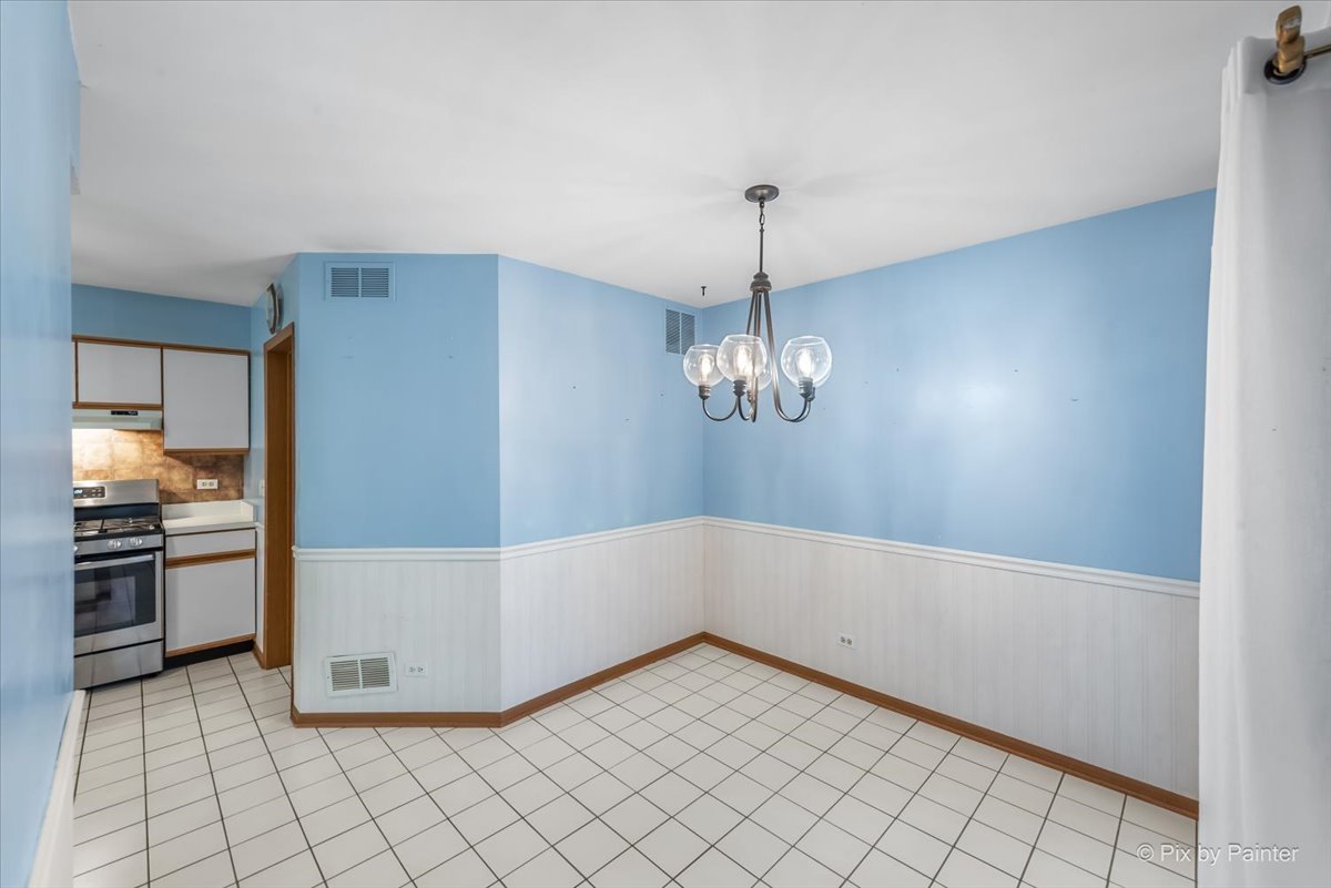 687 Bent Ridge Lane Elgin, IL 60120 - Photo 8 of 28 a view of a kitchen with refrigerator and stove
