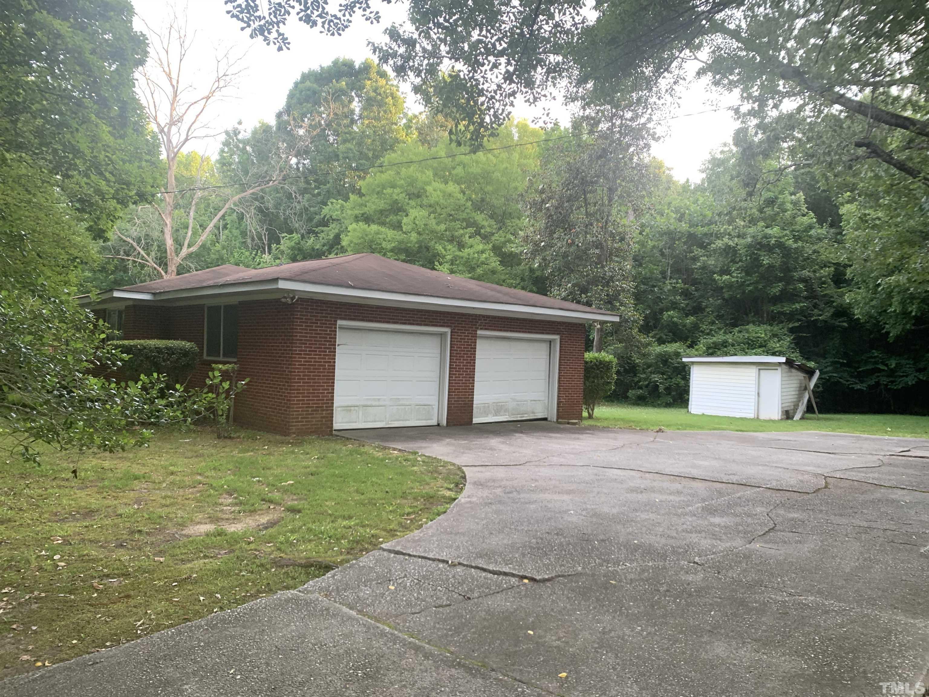 917 Cross Link Road Raleigh, NC 27610 - Photo 3 of 10 a front view of a house with yard and trees