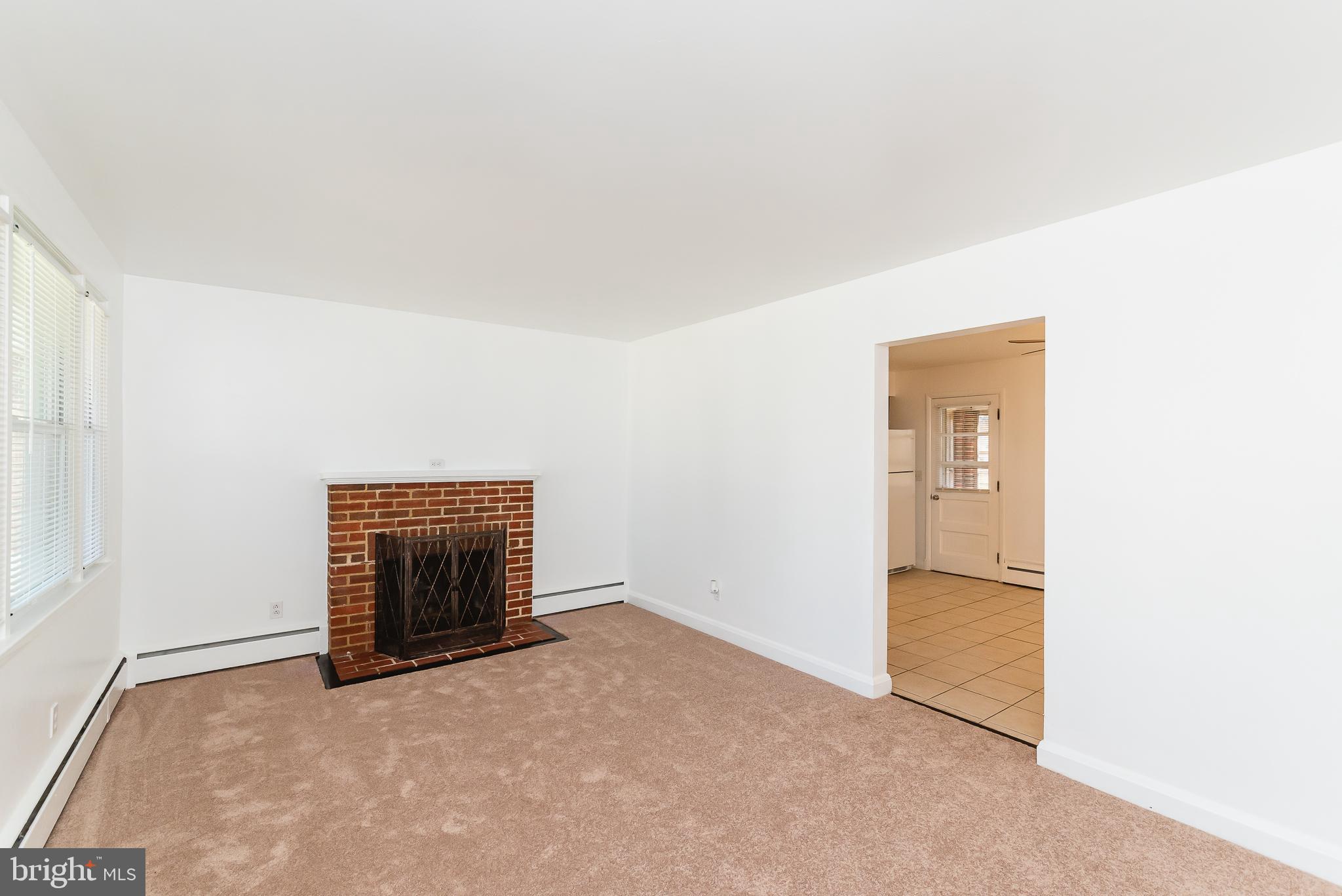 8725 Avondale Road Baltimore, MD 21234 - Photo 18 of 36 Living Room has woodburning fireplace
