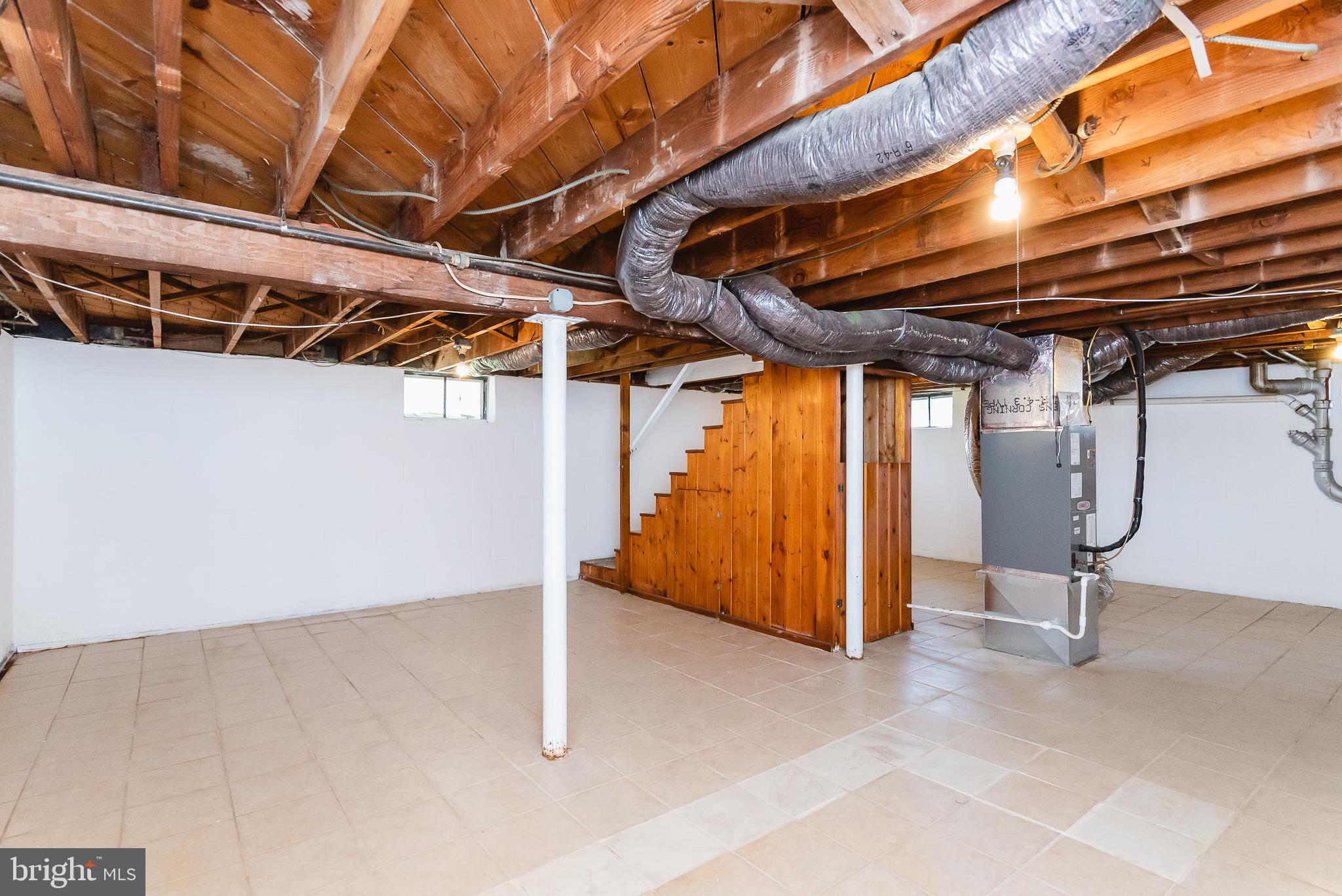 8725 Avondale Road Baltimore, MD 21234 - Photo 24 of 36 Basement - tile floor with french drain