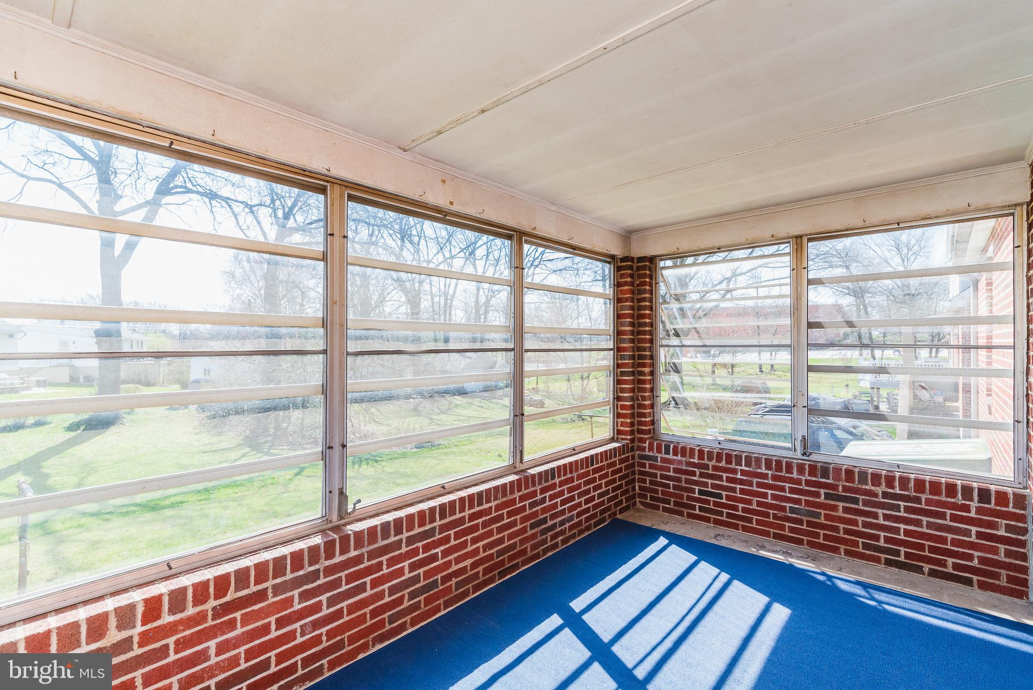 8725 Avondale Road Baltimore, MD 21234 - Photo 27 of 36 Rear enclosed porch with windows and screens