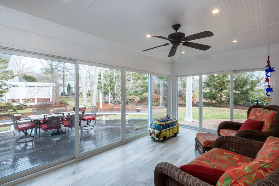 19 Reflection Drive Sandwich, MA 02563 - Photo 11 of 33 a living room with furniture and a floor to ceiling window