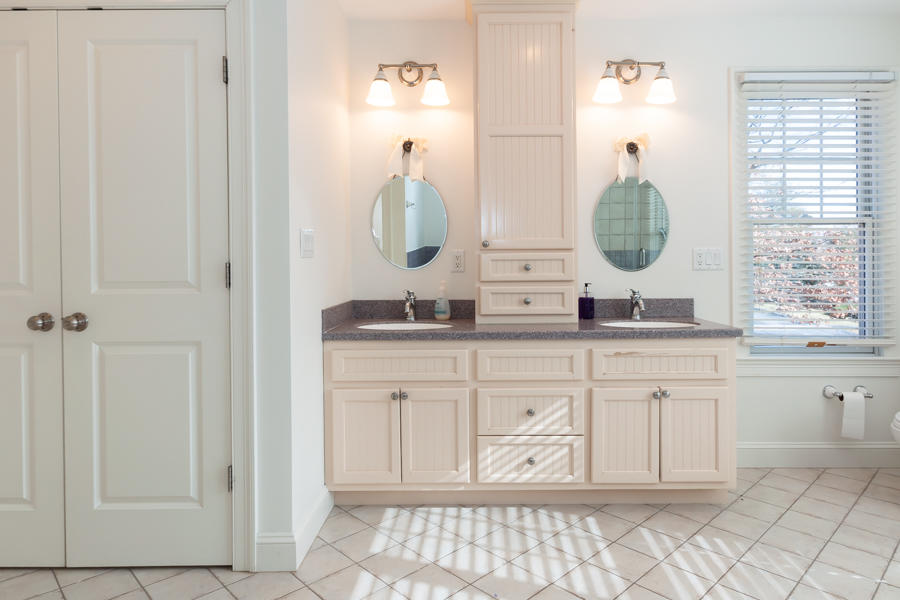19 Reflection Drive Sandwich, MA 02563 - Photo 16 of 33 a bathroom with a granite countertop sink and a mirror