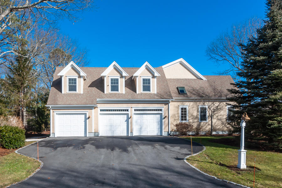 19 Reflection Drive Sandwich, MA 02563 - Photo 24 of 33 a front view of a house with a garden and yard