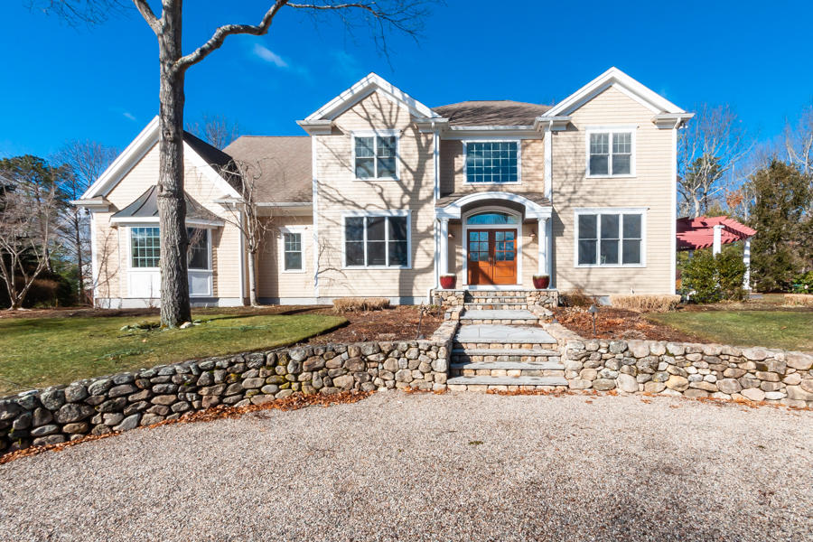 19 Reflection Drive Sandwich, MA 02563 - Photo 30 of 33 a front view of a house with a yard