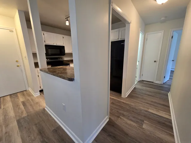 a view of a kitchen from an empty room