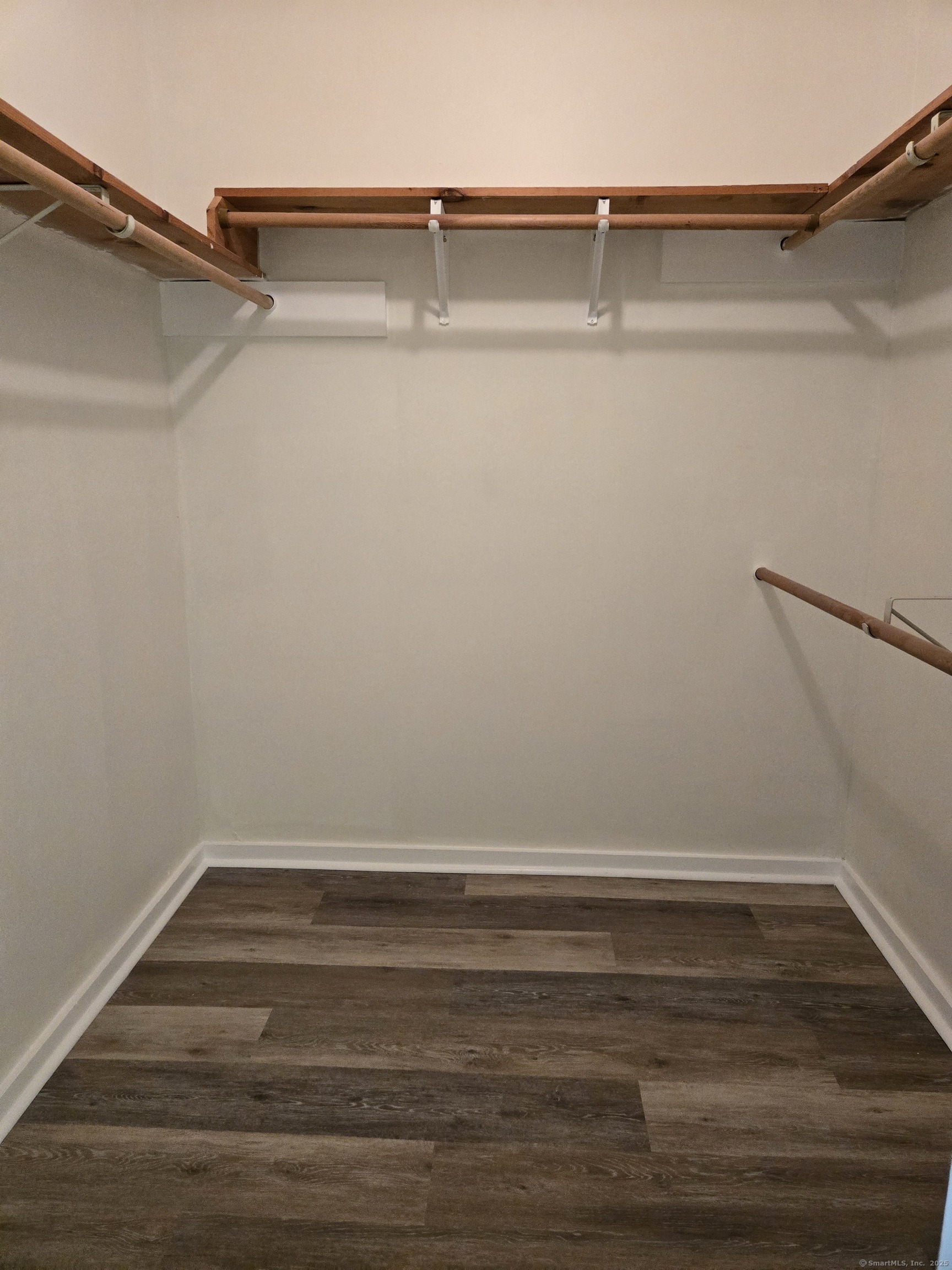 1209 Cromwell Hills Drive, Unit 1209 Cromwell, CT 06416 - Photo 20 of 27 a view of a room with racks on the wall