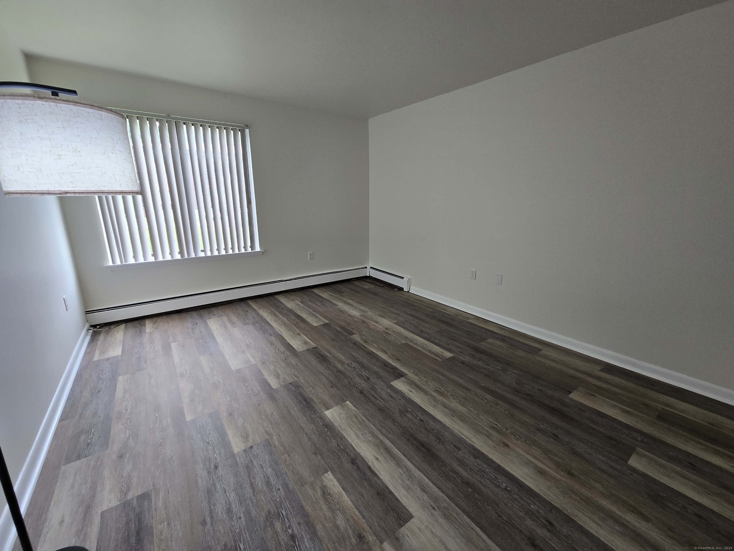 1209 Cromwell Hills Drive, Unit 1209 Cromwell, CT 06416 - Photo 21 of 27 a view of an empty room and wooden floor